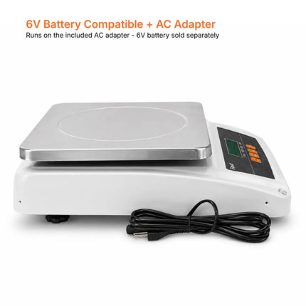 White Equal digital scale with a stainless steel weighing platform and black power cord, shown on a white background with orange text at the top stating '6V Battery Compatible + AC Adapter'.

